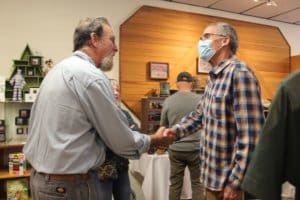 RR Exec Dir John Golay meet artist Leif Voeltz who is donating art show proceeds to Rescue Ranch