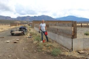 Rescue Ranch Sanctuary in Big Springs_Marc using reclaimed wood to build new enclosure