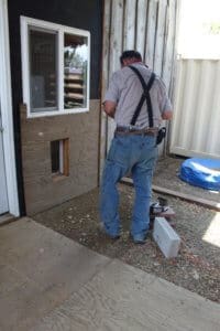 Rescue Ranch Sanctuary, John making a doggy dog for a nursing momma in medical building