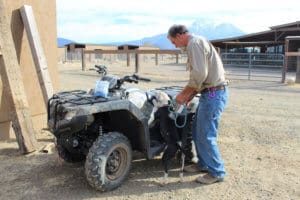 Pocket pittie, John getting Ramona to climb on ATV