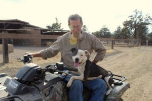 Pocket pittie, Ramona on John's lap on ATV
