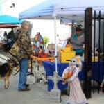 D & S Harley Davidson Pet Day, Red Dog Pet Supply Table with customer and GSD