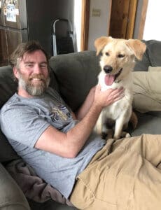 3 stray dogs, Maeve and adopter Raymond