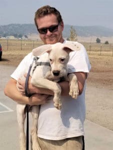 Team member, Ari with Ash when he visits for Sunday socialization class
