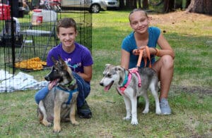 Rescue Ranch volunteers, two young volunteers at Lumberjack Fiesta event, Wyatt & Elexis