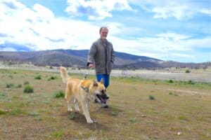 Adoption Center Manager Rick Formanek out on walk with Robbie