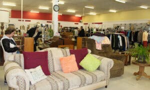 Thrift Store, wideshot of fstore interior with shoppers in background