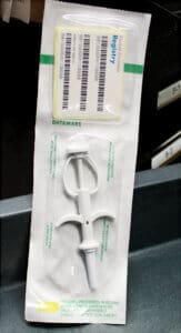 Dog microchips, syringe and registry numbers in package