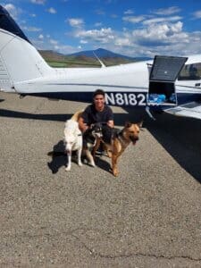 Air Transport, Isslaam posing with dogs at Siskiyou airfield