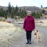 Kenna getting leash training with foster Judy near home.
