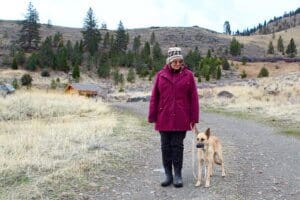 Kenna getting leash training with foster Judy near home.