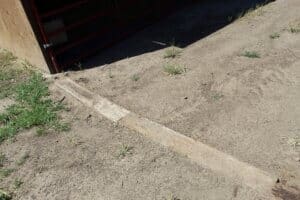 Dig boards to prevent escape under gate