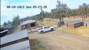 Sequence of John Golay's white truck going through the gate and leaving Sanctuary in the morning