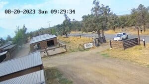 Sequence of John Golay's white truck going through the gate and leaving Sanctuary in the morning