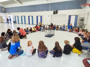 Dog rescues collaborate on presentations to elementary schools