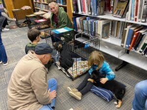 Puppies puppies puppies_OHWS child in blue puffer with puppy et al