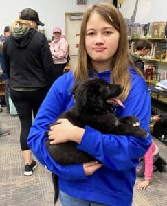 Puppies puppies puppies_Other girl in blue hoodie with puppy in her arms